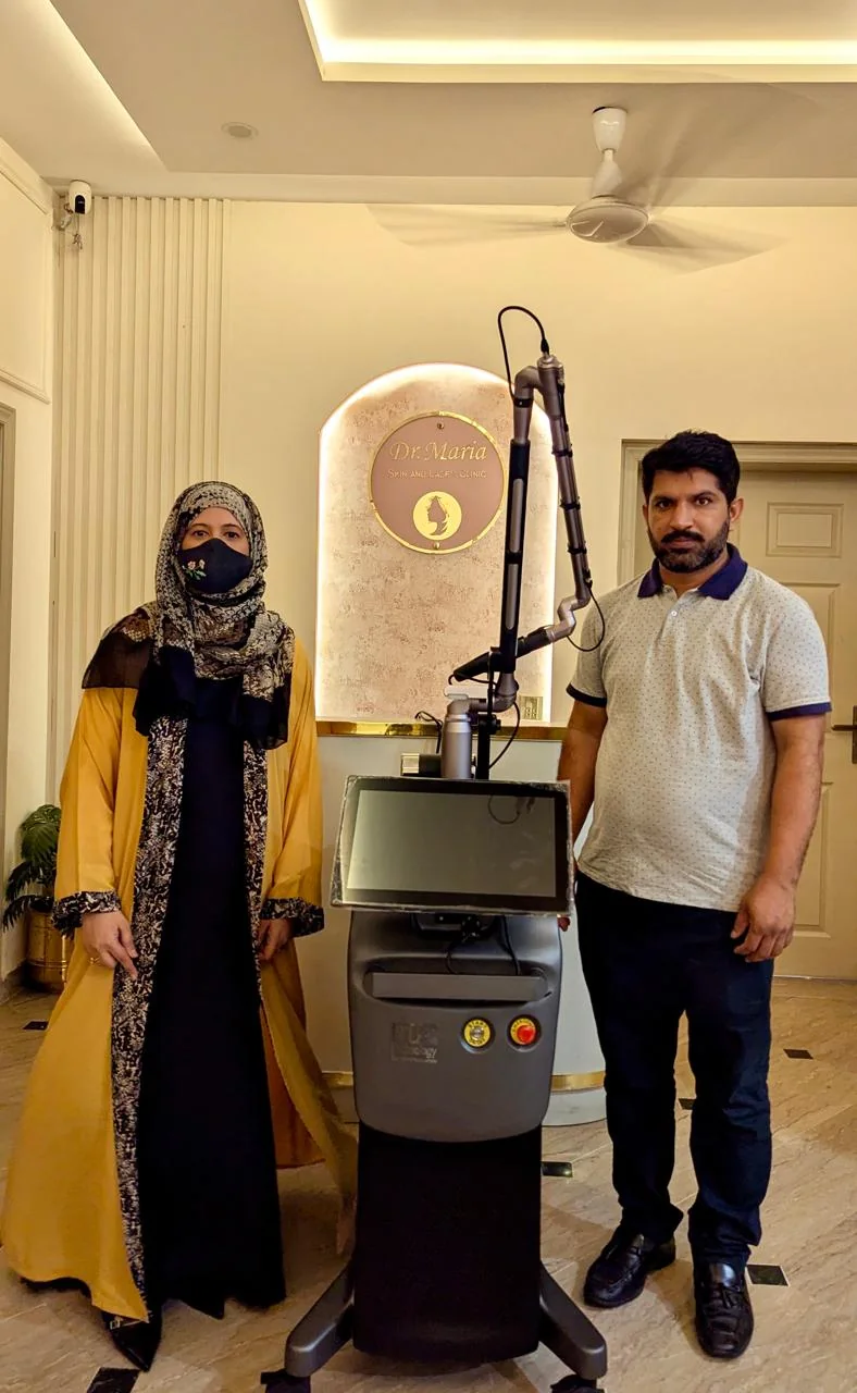 Dr Maria Umer with clinic laser equipment in Wapda Town Lahore